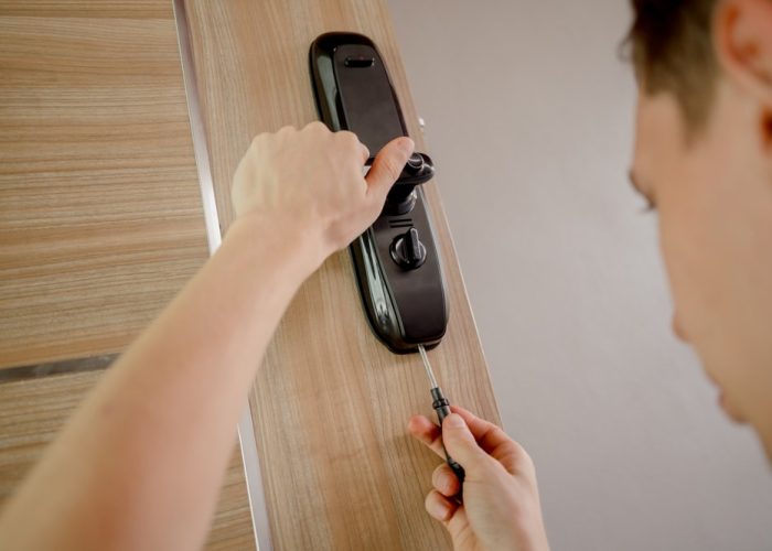 A,Technician,Installs,A,Modern,Smart,Door,Lock,On,The